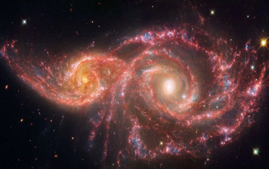 ALMANAQUE-DO-ESTUDANTE-Imagem-Para-o-Artigo-O-Universo-nos-observa-A-beleza-e-o-misterio-das-galaxias-IC2163-e-NGC2207-I.webp